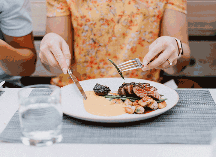 woman hesitantly eating